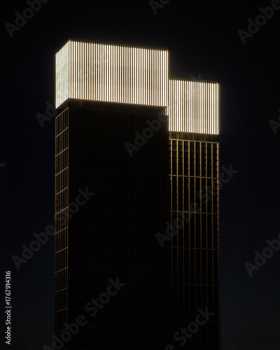 Modern architectural elegance shines at dusk in Moscow's skyline featuring a sleek skyscraper