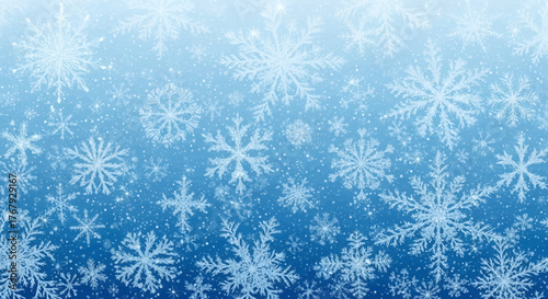 A blue gradient background filled with a variety of white snowflakes, creating a wintery and festive scene.