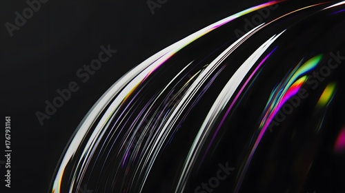 Close up view of iridescent light reflections on a dark, curved surface shows delicate spectral colors