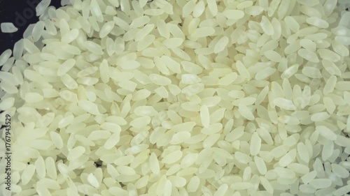 grains of rice on a rotating background.
