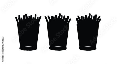 Three tall cups filled with black straws