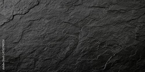 black concrete wall , grunge stone texture , dark gray rock surface background panoramic wide banner