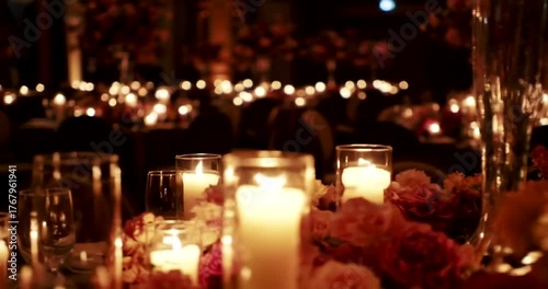 Elegant candlelit dinner setting with floral arrangements in a luxurious venue