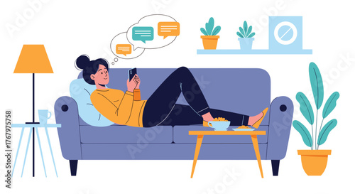 A young woman relaxes on her sofa, engrossed in texting or chatting on her smartphone at home.