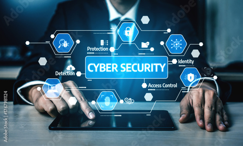 A professional man in a suit uses a tablet to display cyber security graphics and icons, emphasizing the importance of digital protection in modern business environments. Tessel