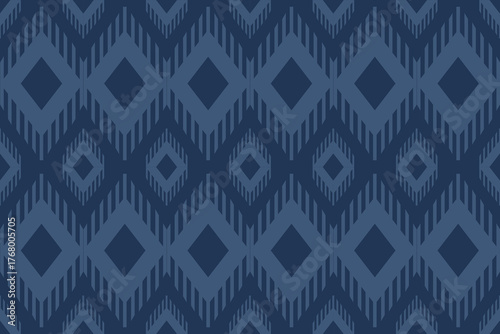 Seamless geometric pattern with chevron and diamond shapes in dark and light blue tones, creating a modern tribal textile or wallpaper design.