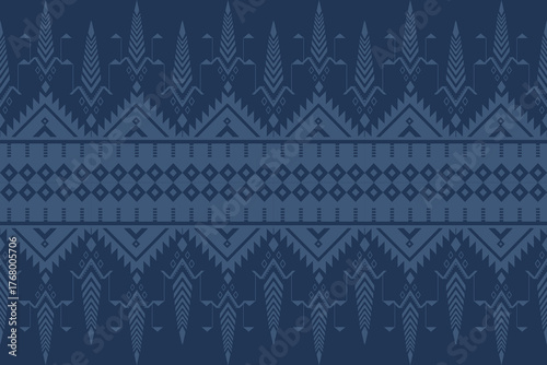 Seamless geometric pattern with chevron and diamond shapes in dark and light blue tones, creating a modern tribal textile or wallpaper design.