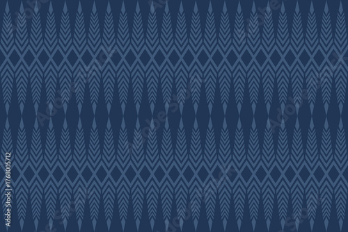 Seamless geometric pattern with chevron and diamond shapes in dark and light blue tones, creating a modern tribal textile or wallpaper design.