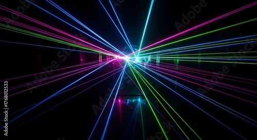 Abstract colorful laser beams shooting from a central point in the darkness