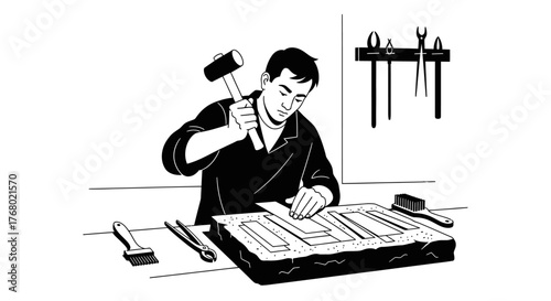 Artisan meticulously working with hammer and tools on a detailed project.