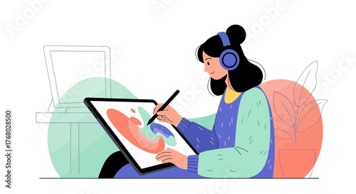 Digital artist creating artwork on a tablet with a stylus in a bright and creative space