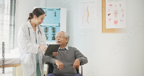 Asian female doctor using a digital tablet to explain health information to an elderly male patient, incorporating AI-assisted tools for better diagnosis, data analysis, and patient understanding.