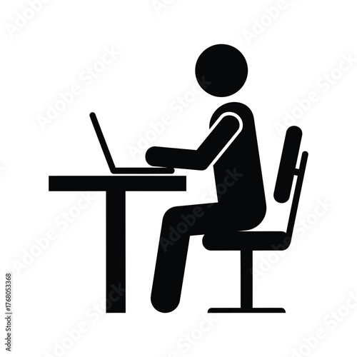 Person working on laptop at desk icon