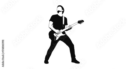 Silhouette of a musician playing an electric guitar, performing on stage.
