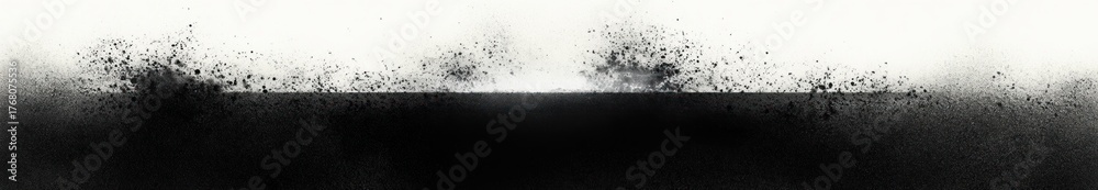 Fototapeta premium Abstract black and white artwork featuring a dense black horizontal band with scattered black speckles and splatters blending into a white background, evoking a sense of dynamic energy and contrast