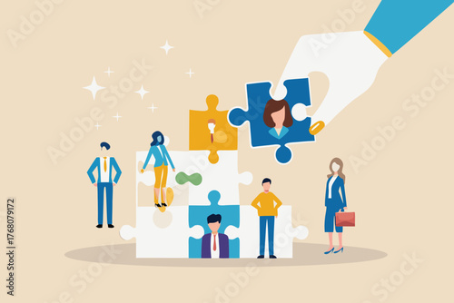 Hand placing a puzzle piece with a woman s portrait into a larger puzzle representing a team building process