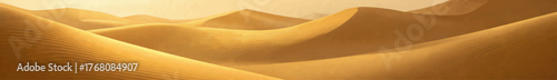 Golden desert dunes with rippled sand patterns, warm sunset lighting, serene landscape