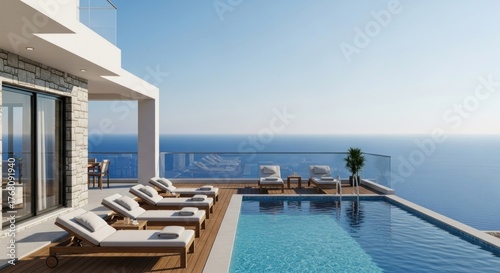 Luxurious modern villa with pool overlooking vast ocean, sunbeds, and clear blue sky