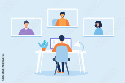 Person participating in a video conference call with colleagues from their home office desk