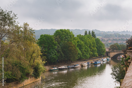 Canal boat and kennet waiting for tourists on the River Avon, another fascinating travel experience in the city of Bath.