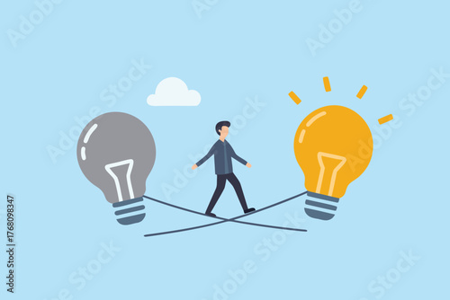 Man walking on tightrope between two giant light bulbs representing ideas and innovation