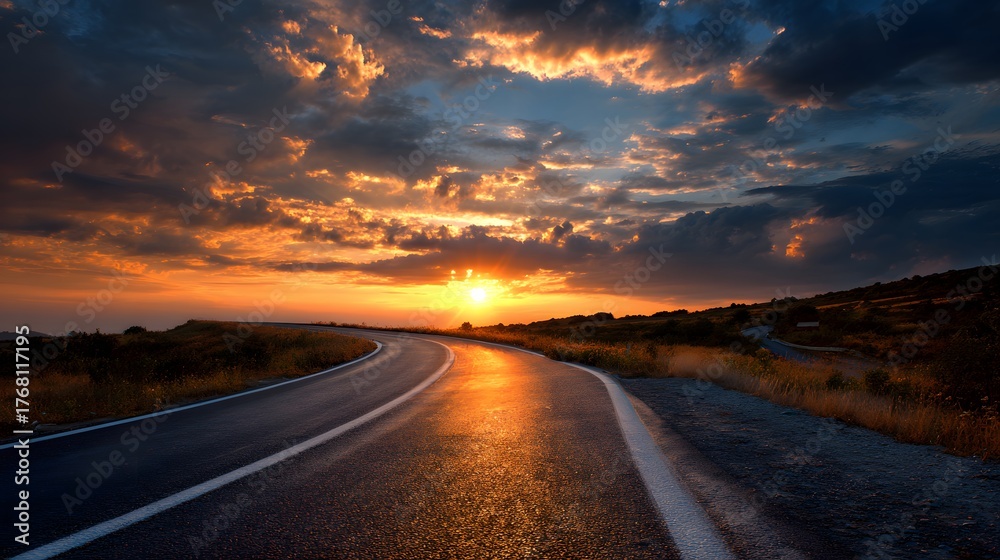 Naklejka premium Winding asphalt highway stretches towards a brilliant sun setting behind dramatic clouds