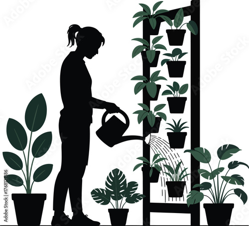 Woman tending to lush vertical garden plants with vibrant green foliage and colorful flowers