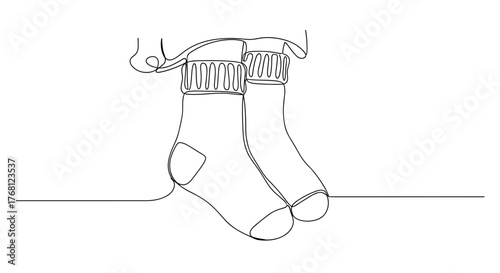 Fuzzy socks sticking from blanket as symbol of comfort and coziness