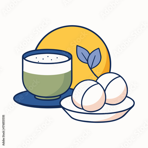 A cup of green tea with mochi on a plate of sweets