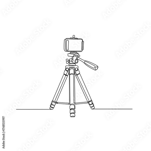 Phone tripod on floor symbolizing content making and preparation