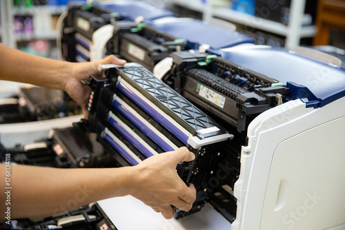 Foto Technician Holding ink printer toner low for replace new or fix repair problem p