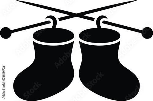 Knitted baby booties and knitting needles silhouette design