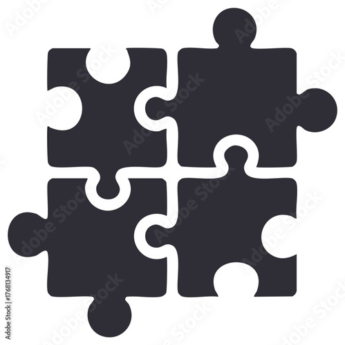 Four jigsaw puzzle pieces fitting together representing teamwork collaboration and problem solving