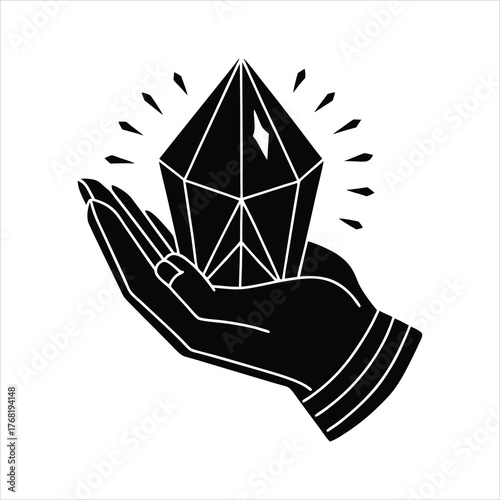 Hand holding a glowing crystal