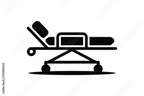 A black and white illustration of a hospital gurney with a pillow and mattress