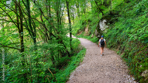 Female tourist hiking the mountain trails of the Alps in Slovenia.