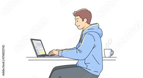 A man in a blue hoodie sits at a table working on a laptop with a coffee cup beside him on a plain white background.