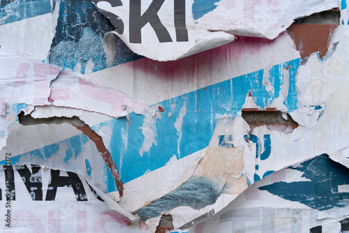 Torn and ripped street poster background, old paper texture