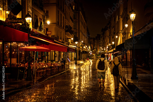 Photography Night View of Restaurants and Cafés on Rue Montorgueil with Reflections after Ra