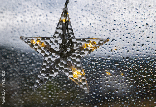 star shaped Christmas light in window