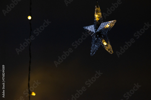 star shaped Christmas light in window