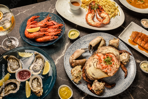 mixed traditional portuguese seafood meal on indoors lisbon restaurant table in portugal