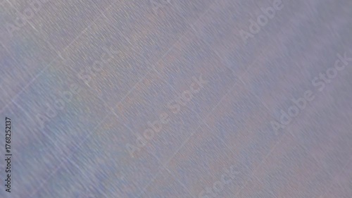 iridescent surface displaying a mesmerizing pattern of tiny, shimmering dots, organic pattern. The texture appears slightly raised, creating a ripple effect both abstract and vibrant