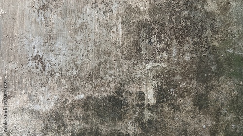 Extreme close-up of a heavily weathered, dirty, and grungy concrete wall surface with dark mold.