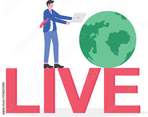 A businessman stands next to a globe while holding a board with the word LIVE,
