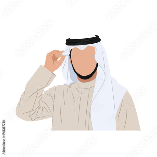 Man in traditional arab clothing adjusts his headwear in a simple studio shot, showcasing cultural attire and subtle gesture.