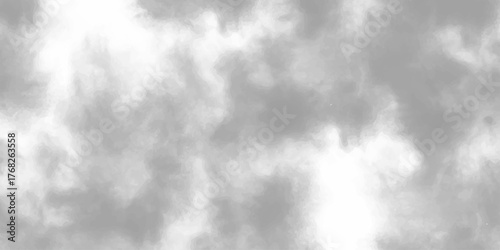 A dramatic black and white abstract background features dark clouds in a smoky atmosphere
