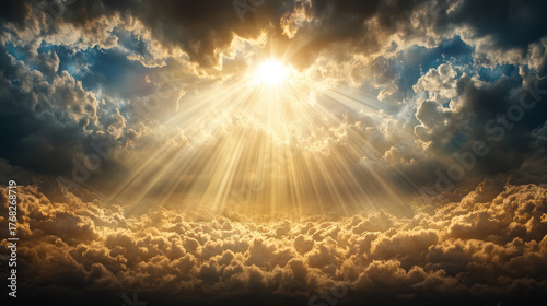 Fototapeta Naklejka Na Ścianę i Meble -  Golden beams shining through drifting clouds create cinematic atmosphere of serenity and awe