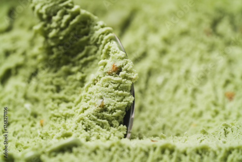 Close-up pistachio ice cream background scooping