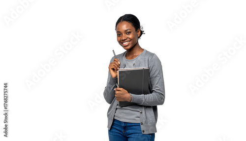 Young african american woman smiling, holding a pen and a notebook, on a white background, cutout